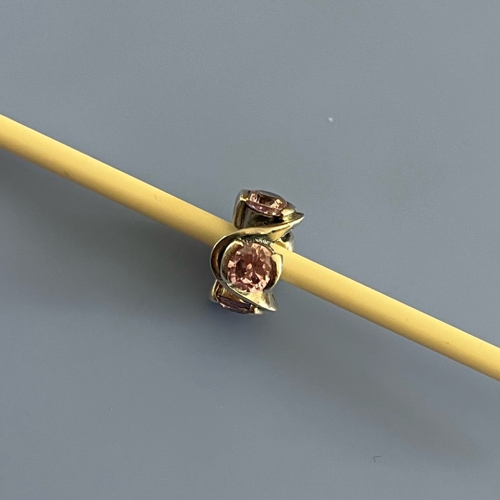 Chamilia sterling silver retired Forever bead with light pink CZ stones.